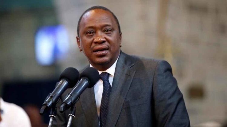 Kenyan President Uhuru Kenyatta signs the bill to regulate digital lenders
  