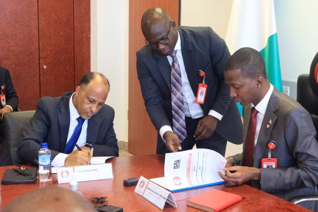 L-r: President, NIRA, Muhammed Rudman, and the Executive Chairman of the EFCC, Abdulrasheed Bawa, during the agreement signing ceremony in Abuja.