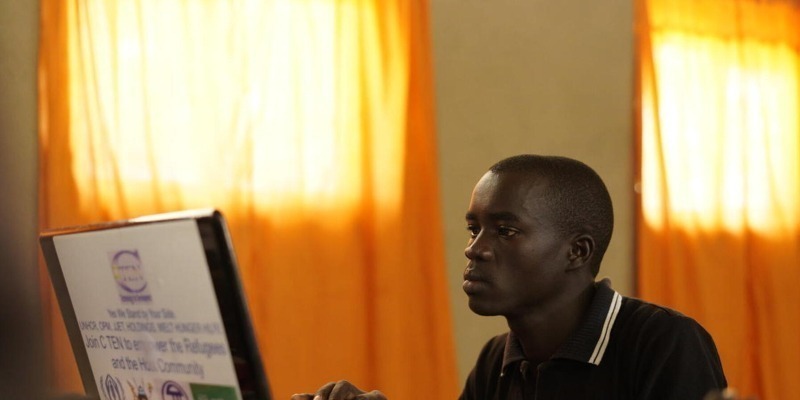 Uganda refugee surfing the internet