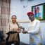 Professor Charles Chukwuma Soludo, the Governor of Anambra State, receiving the induction plaque presented by Chinwe Okoli, the Special Adviser to the Governor on Innovation and Business Incubation who serves as the CEO of Solution Innovation District.