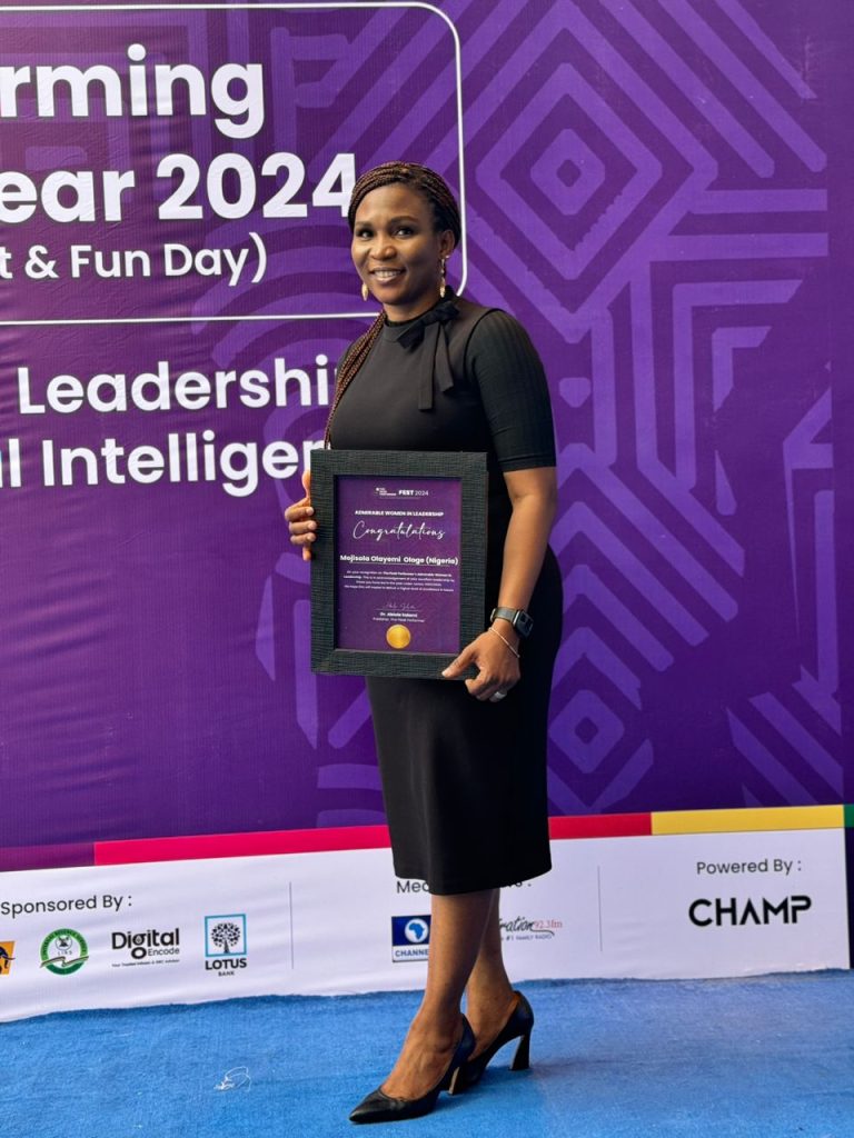 Mojisola displays The Peak Performer FEST 2024 Admirable Woman in Leadership Award.