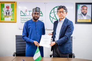 The DG NITDA, Kashifu Inuwa CCIE (left) and the Chief Consultant of the project, Teruyasu Ezure (right) with the signed agreement